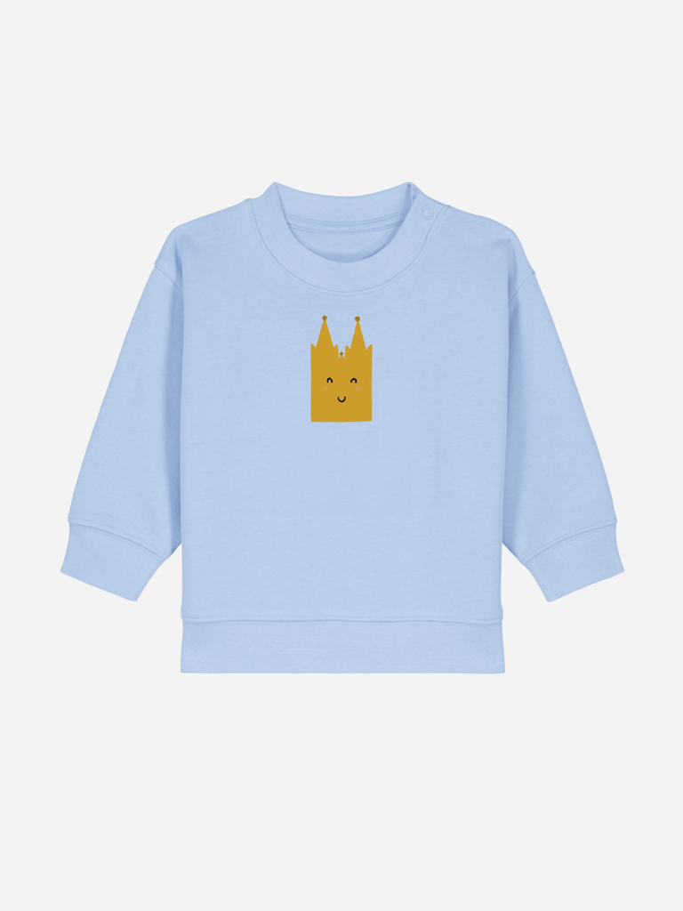 Personalisierbarer blauer Bio-Pullover für Babys mit lächelndem Kölner Dom-Motiv.