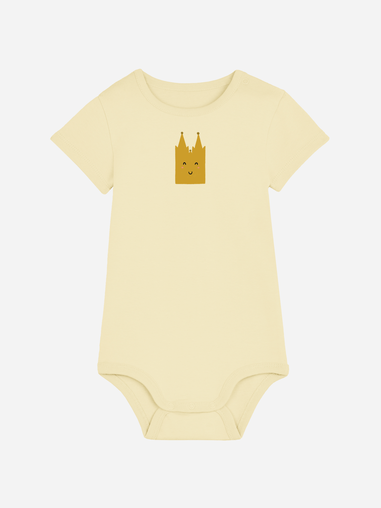 Personalisierter Baby-Body in Gelb mit fröhlichem 'Dom' Motiv für Kölner Neugeborene.