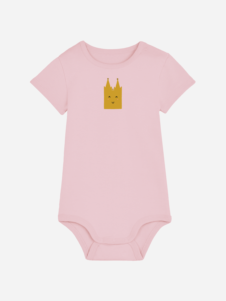 Personalisierter Baby-Body in Rosa mit fröhlichem 'Dom'-Motiv, ideal als Geschenk für Kölner Nachwuchs.
