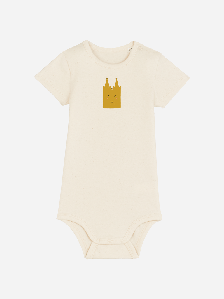 Personalisierter Baby-Body in Creme mit lächelndem Kölner Dom-Motiv für 0-2 Jährige.