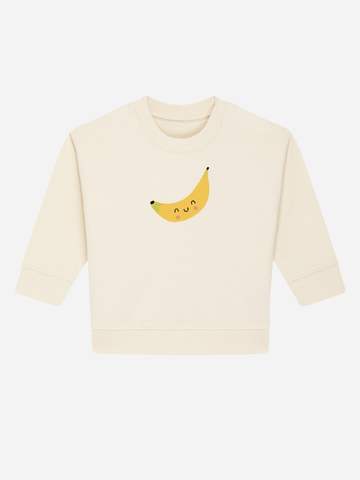 Personalisierbarer Bio-Pullover für Kinder (0–3 J.) mit lustigem Banane-Motiv in hellem Beige.