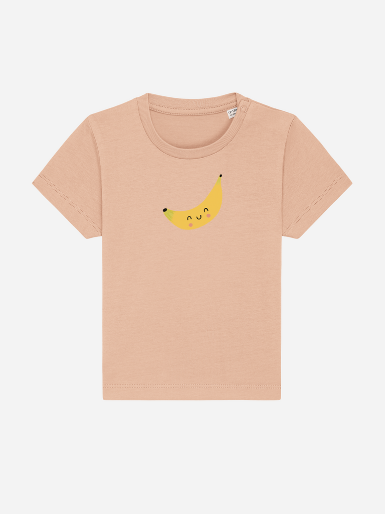 Personalisierbares Bio-T-Shirt (0–3 J.) 'Banane' in sanften Farben mit lächelndem Bananenmotiv.
