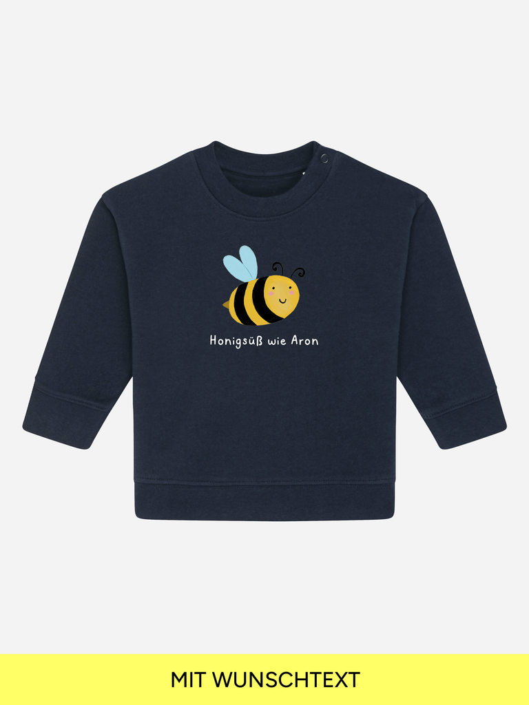 Liebevoll gestalteter Bio Pullover mit einer summenden Biene als bleibendes Geschenk zur Taufe oder Geburt.